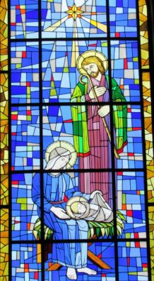 Colorful stained glass depicting the Nativity scene in a Brazilian church, offering a vivid and sacred ambiance.